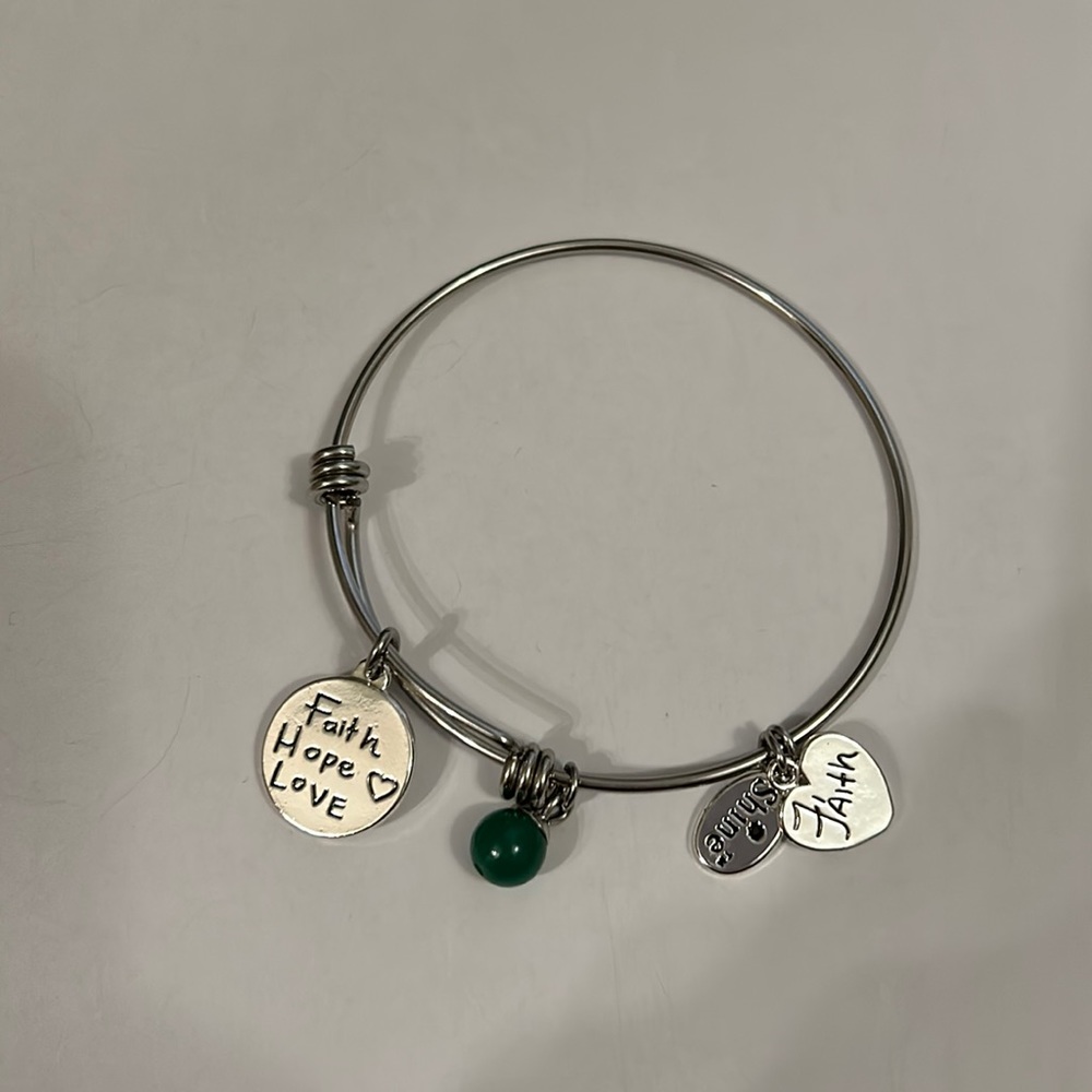 Bracelet with faith hope love charm, faith charm, shine charm and green bead
